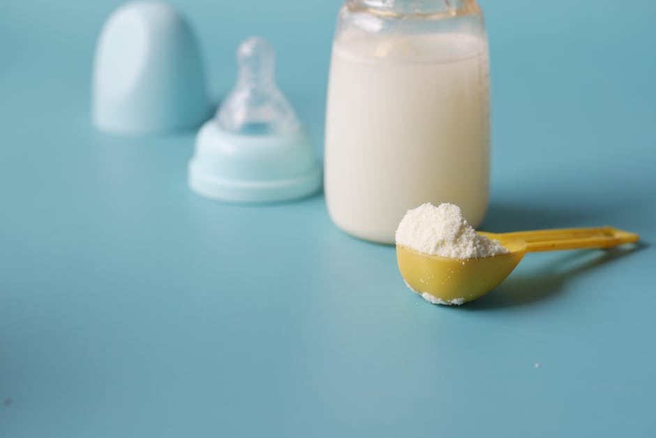 A Close-Up Shot of a Scooped Formula Milk Powder